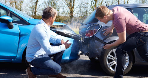 Stock image of a car crash scene, representing the legal services offered by Ron Sholes, P.A. for victims of car accidents