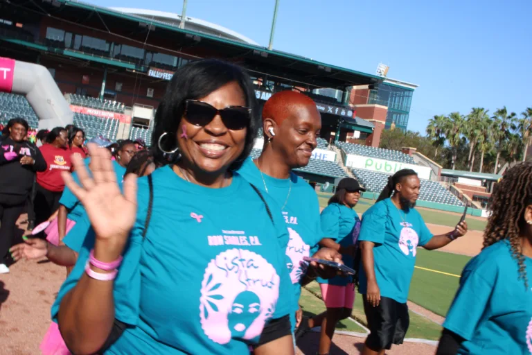 Group of walkers in Sista Strut shirts at Jacksonville breast cancer walk, Ron Sholes sponsors.