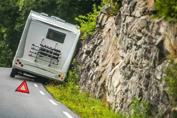 Stock image showing an RV in an accident on the side of the road, symbolizing the impact of a collision and Ron Sholes, P.A.'s commitment to assisting victims in recovering from auto accidents and securing compensation for damages
