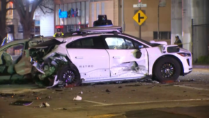 “Damaged self-driving car on Florida road after accident – legal support available for self driving vehicle crash victims