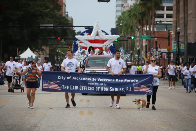 The Law Offices of Ron Sholes employees at Veteran's day parade