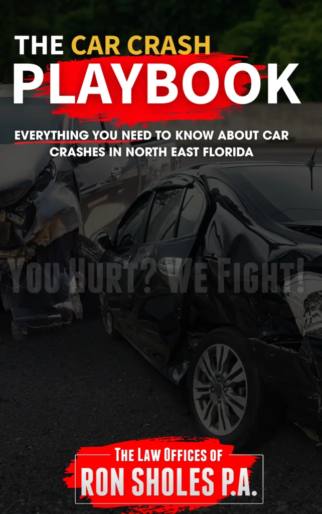 Promotional graphic for "The Car Crash Playbook" by The Law Offices of Ron Sholes P.A. featuring a close-up of a wrecked black sedan and a damaged truck. Text reads: "Everything you need to know about car crashes in North East Florida. You hurt? We fight!"